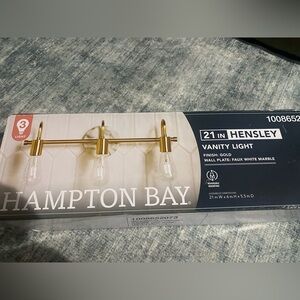 New Hampton bay 21 in. Hensley Gold Vanity Light - 3-Light faux white marble